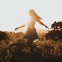 Woman walking in field | Wealthify