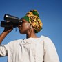 woman looking through binoculars | wealthify.com 