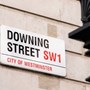 Photograph of the street sign for Downing Street in London. 